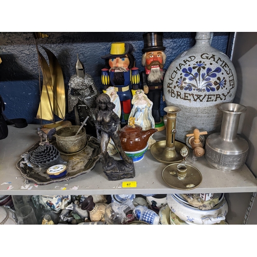 67 - A mixed lot to include a silver plated footed tray, ceramic and resin figures, nut crackers, brass b... 