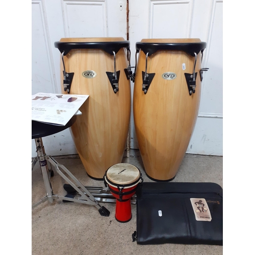 A pair of Cosmic Percussion conga light wood drums, with stand and 