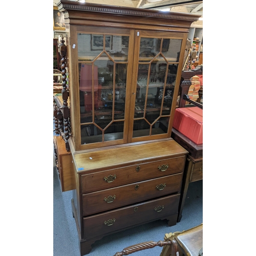 349 - A 19th century and later mahogany and string inlaid bookcase having twin glazed doors above three lo... 