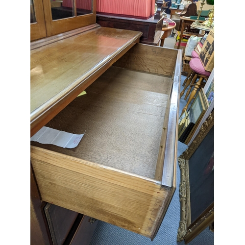 349 - A 19th century and later mahogany and string inlaid bookcase having twin glazed doors above three lo... 