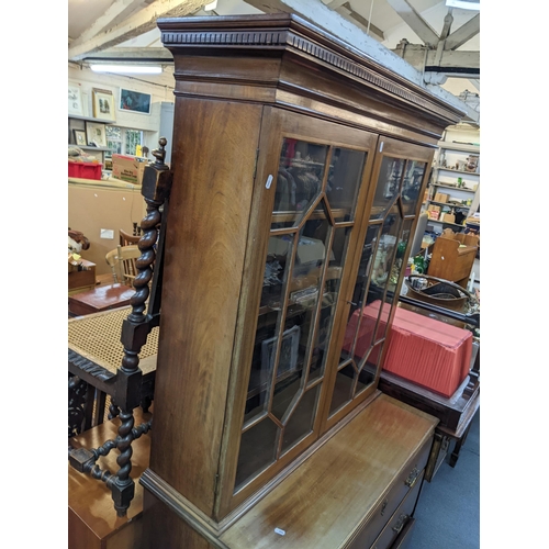 349 - A 19th century and later mahogany and string inlaid bookcase having twin glazed doors above three lo... 