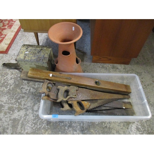 126 - A mixed lot to include a terracotta garden forcer, a painted metal ammunition box, various saws and ... 