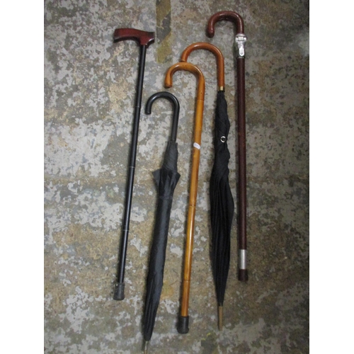 157 - Walking canes, umbrellas and shooting stick, the leather clad shooting stick by Swaine & Briggs, a P... 