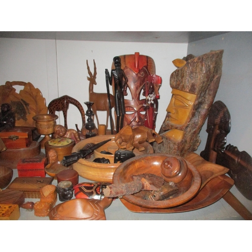 161 - A wide selection of treen to include African carved tribal art wall masks and busts, various boxes a... 