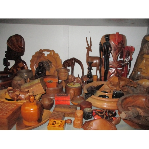 161 - A wide selection of treen to include African carved tribal art wall masks and busts, various boxes a... 