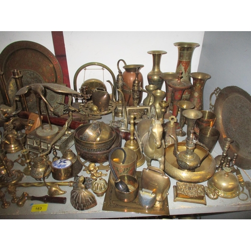 163 - A quantity of brassware to include various lady tea bells, desk bells and others, horse brasses, a p... 