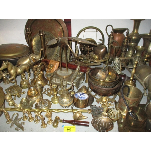 163 - A quantity of brassware to include various lady tea bells, desk bells and others, horse brasses, a p... 