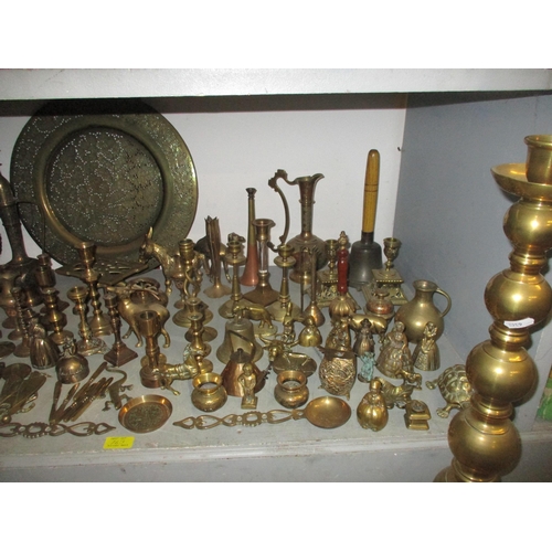 163 - A quantity of brassware to include various lady tea bells, desk bells and others, horse brasses, a p... 