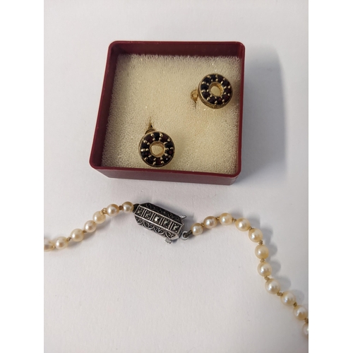 166 - A pearl necklace with a silver and marcasite clasp and a pair of silver gilt earrings
Location: CAB3