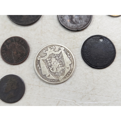 253 - A group of mixed British coinage - a 1675 Charles II farthing, Irish halfpenny, George III halfpenni... 