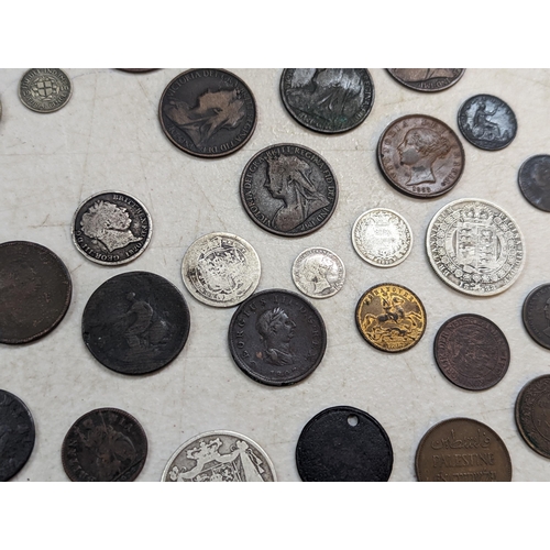 253 - A group of mixed British coinage - a 1675 Charles II farthing, Irish halfpenny, George III halfpenni... 