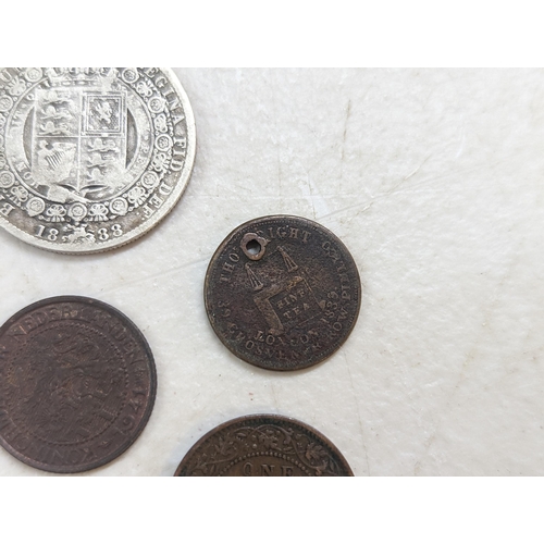 253 - A group of mixed British coinage - a 1675 Charles II farthing, Irish halfpenny, George III halfpenni... 