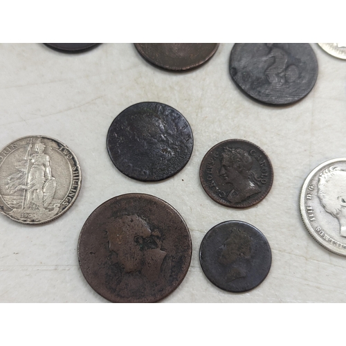 253 - A group of mixed British coinage - a 1675 Charles II farthing, Irish halfpenny, George III halfpenni... 