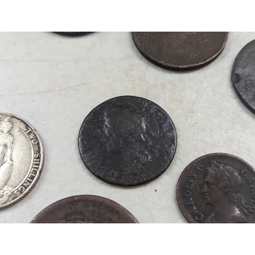 253 - A group of mixed British coinage - a 1675 Charles II farthing, Irish halfpenny, George III halfpenni... 