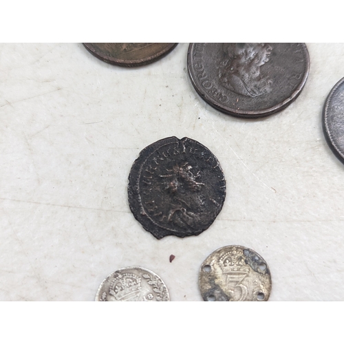 253 - A group of mixed British coinage - a 1675 Charles II farthing, Irish halfpenny, George III halfpenni... 