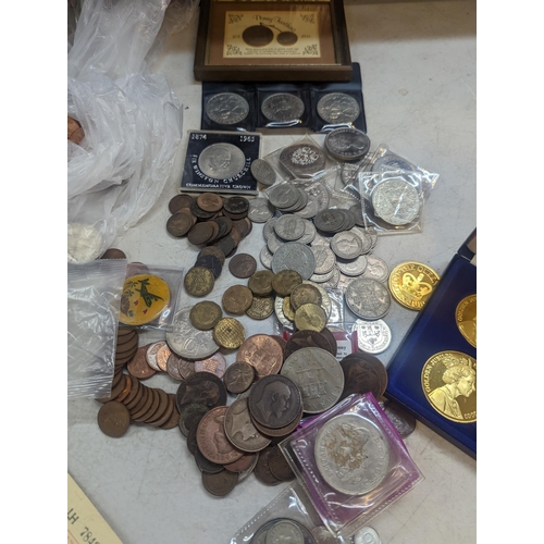 254 - A large collection of coins to include a quantity of British commemorative Crowns, Victorian and lat... 