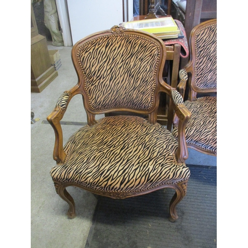 361 - Two reproduction French style walnut armchairs upholstered in a tiger pattern fabric (upholstered ap... 