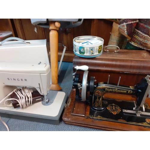 393 - A vintage dress-makers mannequin together with a Frister & Rossmann sewing machine, a retro electric... 