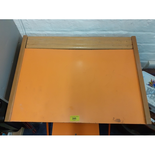 395 - A retro child's desk painted orange and a matching stool
Location: RWB