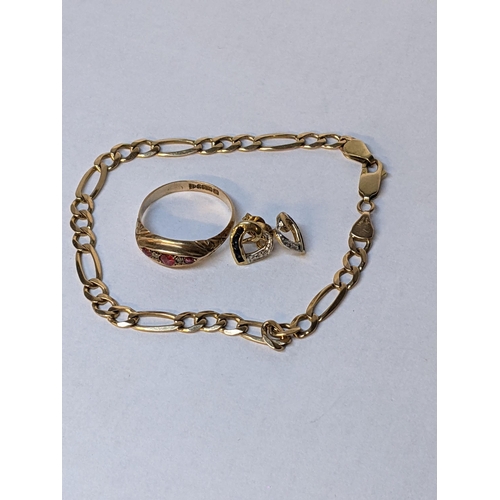 101 - A 9ct gold bracelet to include a pair of 9ct heart shaped earrings sapphires, and a 9ct ring with di... 