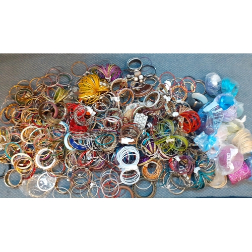 154 - A large quantity of colourful and modern bangles with an Indian theme
Location: RAB