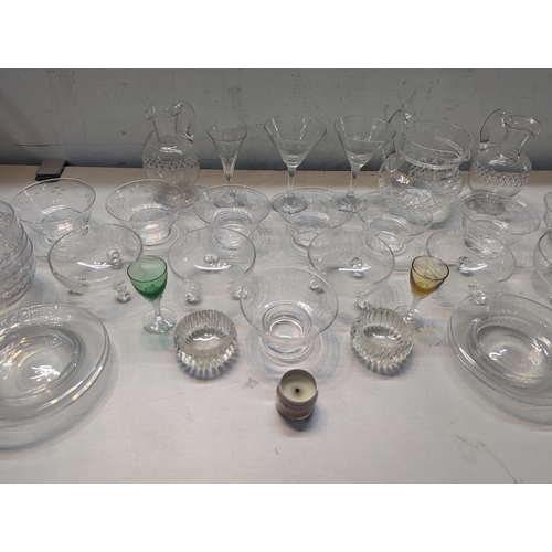 65 - A mixed lot of glassware to include Stuart glassware jugs, dishes, coloured glasses and others
Locat... 