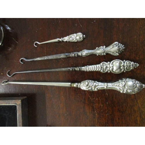 467 - Silver to include clad, glass condiment, silver condiments, silver handled button hooks, manicure se... 