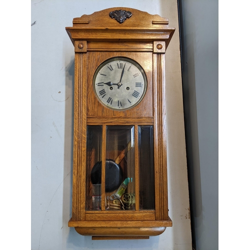 481 - An early 20th century oak cased 8-day wall hanging clock
Location: A4M