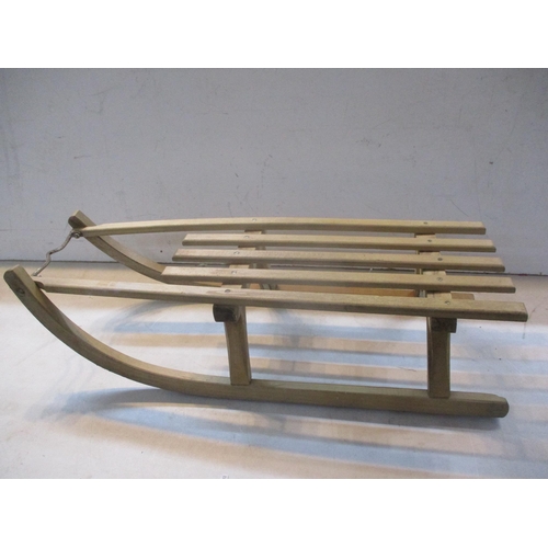 545 - A vintage wooden sledge with metal runners
Location: LWF