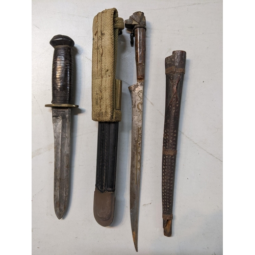 546 - Two knives to include an early 20th century fighting knife, the blade inscribed 'Brescia', together ... 