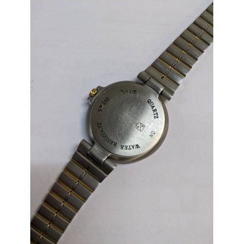 50A - A Dunhill quartz bi-coloured metal wristwatch having a white enamel dial with Roman numerals and dat... 