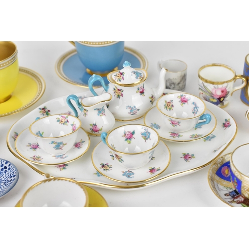 32 - A Crown Staffordshire miniature porcelain cabaret set, with floral pattern, together with two miniat... 