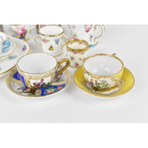 32 - A Crown Staffordshire miniature porcelain cabaret set, with floral pattern, together with two miniat... 