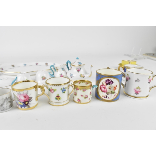 32 - A Crown Staffordshire miniature porcelain cabaret set, with floral pattern, together with two miniat... 