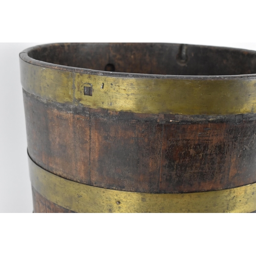 33 - A Georgian brass bound mahogany wine cooler, 30 cm high x 41 cm diameter
Provenance: Contents of the... 