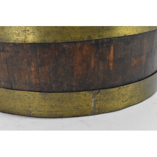 33 - A Georgian brass bound mahogany wine cooler, 30 cm high x 41 cm diameter
Provenance: Contents of the... 