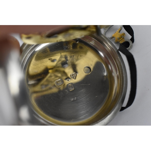 177 - A late 19th silver open faced pocket watch having a white enamel dial, signed, with blued hands, Rom... 