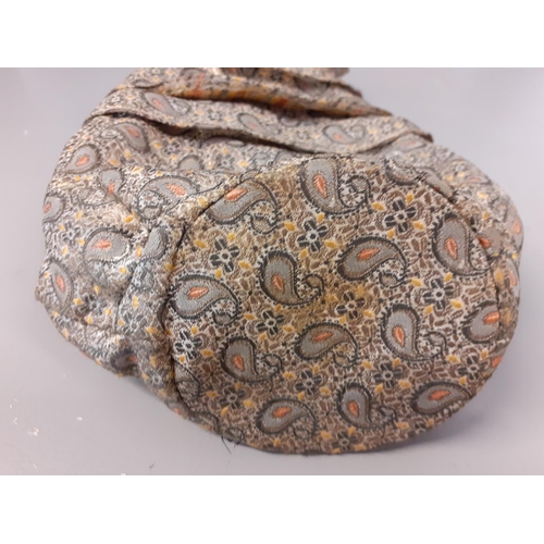 157 - An early 20th Century Eastern inspired brocade evening bag in a green paisley design having a painte... 