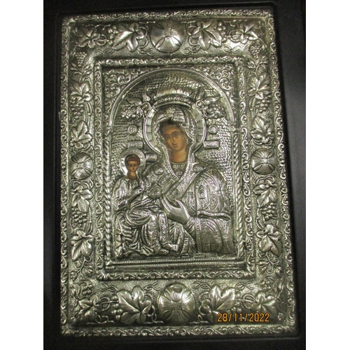 426 - A group of modern icons, some with white metal repousse decorated covers/surrounds, two stamped with... 