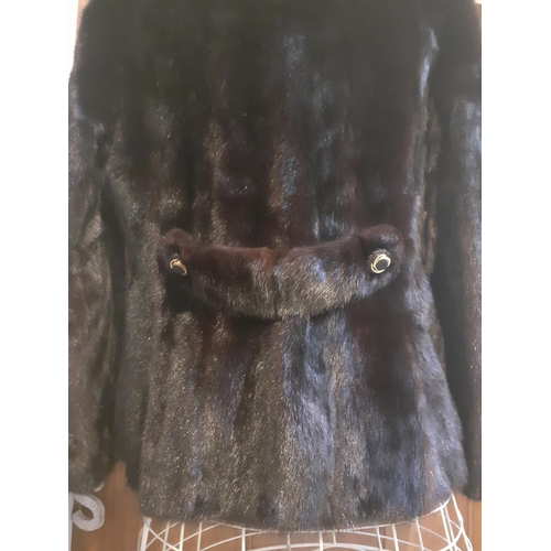 378 - A late 20th Century Blackglama natural dark ranch mink jacket with 3 fabric and gold tone buttons, h... 