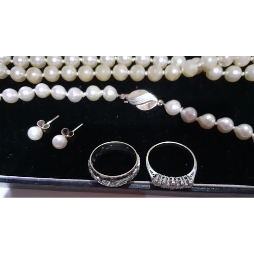 379 - A sting of simulated pearls with a 9ct gold clasp and another string of simulated pearls together wi... 