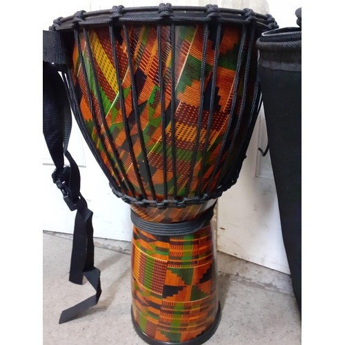 407 - A Remo Djembe drum by Paula Mattioli signature series with rope and cable tensioning system together... 