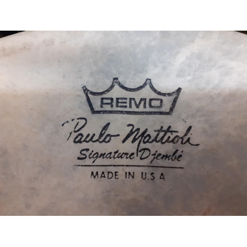 407 - A Remo Djembe drum by Paula Mattioli signature series with rope and cable tensioning system together... 