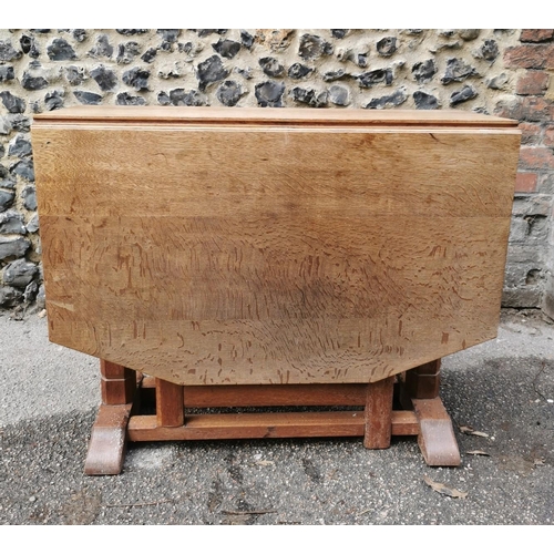 420 - A 1940s Heals oak drop leaf dining table, the leaves with canted corners, over square chamfered supp... 