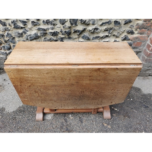 420 - A 1940s Heals oak drop leaf dining table, the leaves with canted corners, over square chamfered supp... 