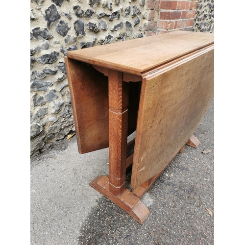 420 - A 1940s Heals oak drop leaf dining table, the leaves with canted corners, over square chamfered supp... 