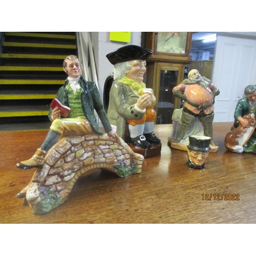 110 - A group of Royal Doulton figurines, Toby and character jugs to include Robert Burns HN3641, Falstaff... 