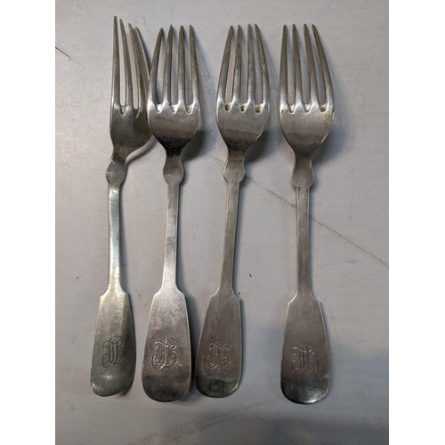 12 - A set of four continental white metal forks engraved with family initials to the handles, 250.4g Loc... 