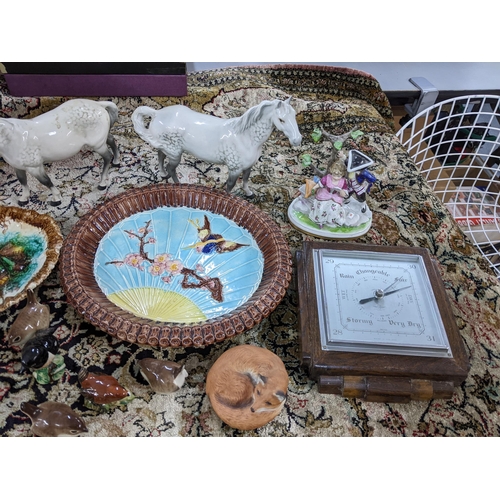 132 - A mixed lot to include Majolica bird and prunus pattern dish, 1930s oak barometer, two Beswick horse... 