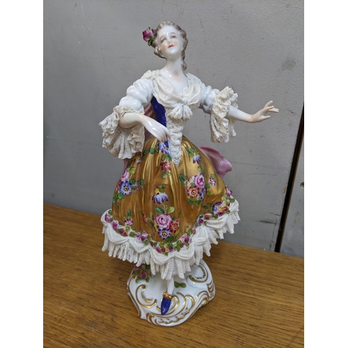 149 - A 19th century Volkstedt porcelain figure of a dancing lady, 23.5 cm high, together with two Capodim... 